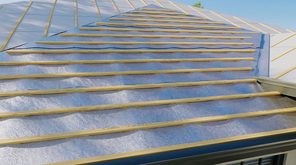 Roof under construction with metal sheets and wooden battens.