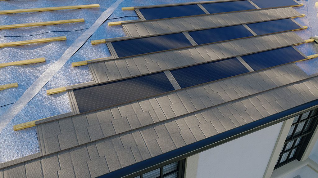 Close-up of a roof under construction with solar panels being installed among gray shingles, wooden beams, and visible underlayment.